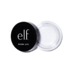 Une boîte ouverte de 8,8 g de gel Elf Brow Lift Cire pour Sourcils Transparente, avec une base transparente et un couvercle noir portant le texte blanc "e.l.f. BROW LIFT". Le couvercle est enlevé et placé à côté du gel pour sourcils transparent. Dakar