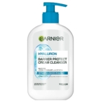 Un flacon pompe blanc de Garnier Crème Nettoyante Protectrice à l'Acide Hyaluronique 250 ml avec des accents bleus, mettant en évidence la glycérine, l'acide hyaluronique, l'aloe vera, et une formule végétalienne sur l'étiquette. Dakar