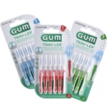 Trois paquets de Gum Trav Ler 6 Brossettes Interdentaires Réutilisables en bleu, rouge et vert sont présentés côte à côte dans leur emballage, chacun contenant six brosses réutilisables avec des capuchons de protection. Dakar