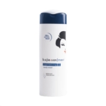 Un flacon blanc de Kojie San Men Lightening Body Wash avec un bouchon bleu marine, un texte bleu et noir, et un visage illustré avec des lèvres rouges sur l'étiquette frontale. Dakar