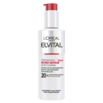 Un flacon blanc de L'Oréal Paris Elvital Bond Repair Leave-In Serum avec une pompe rouge, présentant des détails sur le produit en noir et rouge, et des allégations sur la réparation et la brillance des cheveux. Dakar