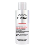 Le flacon blanc de L'Oréal Elvital Soin Pré Shampooing Réparateur Anti-Cheveux Abîmés 200 ml présente un texte rouge, noir et argenté, et permet de réparer les cheveux abîmés en renforçant la kératine avant le shampooing. Dakar