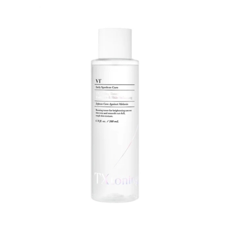 Un flacon en plastique transparent étiqueté "Vt Tonique à Base d'Acide Tranexamique Anti Taches et Hydratant 200ml" se tient debout avec un bouchon blanc, présentant un design minimaliste et contenant 200 ml de tonique transparent pour le soin de la peau. Dakar