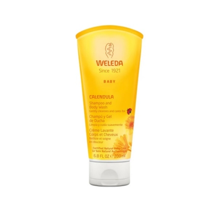 Tube jaune de 200 ml de shampooing et de gel douche pour bébés au calendula de Weleda, avec des détails sur le produit et un motif floral sur le devant. Dakar