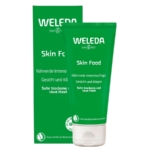 Un tube vert de la crème hydratante Weleda Skin Food se trouve devant sa boîte verte assortie. Tous deux affichent un texte blanc en allemand et en anglais, indiquant que le produit est destiné aux peaux très sèches et rugueuses du visage et du corps. Dakar