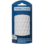 Un diffuseur Yankee Candle ScentPlug blanc et texturé est présenté dans son emballage bleu, avec le nom du produit et un motif géométrique décoratif sur la face avant. Dakar