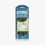 Un paquet de recharges ScentPlug de Yankee Candle dans la senteur Vanilla Lime. L'emballage est bleu avec des images de citron vert et de vanille, et contient deux flacons de recharge visibles à travers une fenêtre transparente. Dakar