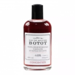 Un flacon transparent de bain de bouche Botot avec un liquide rouge foncé, un bouchon noir et une étiquette blanche en français indiquant qu'il s'agit d'un produit concentré pour l'hygiène buccale, purifiant et rafraîchissant, contenant des essences naturelles. Dakar
