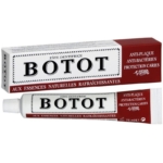 Un tube et une boîte de dentifrice Botot, étiqueté en français, mettant en valeur les propriétés anti-plaque, anti-bactériennes et de protection de la cavité, avec des essences naturelles rafraîchissantes. Le tube contient 75 ml de dentifrice. Dakar