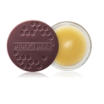 Un petit récipient rond en verre contenant le baume à lèvres Burt's Bees Soin Intensif de Nuit pour les Lèvres 7,08 g avec un couvercle marron foncé à motif hexagonal, partiellement ouvert pour montrer le baume jaune à l'intérieur. Dakar