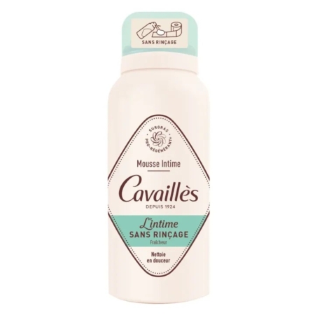 Une bouteille de Cavaillès Mousse Intime Sans Rinçage, une mousse nettoyante intime, avec un motif blanc et vert menthe et un texte français sur l'étiquette. Dakar