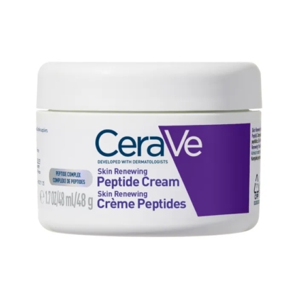 Un pot blanc de CeraVe Skin Renewing Peptide Cream avec une étiquette violette et bleue, indiquant le nom du produit et la taille, 48 ml (1,7 oz), sur un fond blanc. Dakar