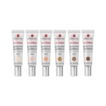 Six tubes de Erborian CC Crème Soin Correcteur Teinté Bonne Mine Et Eclat, tous debout, présentent les teintes Porcelaine, Clair, Doré, Caramel et Riche sur un fond blanc. Dakar