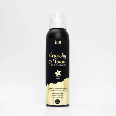 Une boîte noire et dorée étiquetée "Crunchy Foam Stimulant" avec un parfum de vanille, avec un bouchon blanc et un motif de vague doré au fond, debout sur un fond blanc uni. Dakar