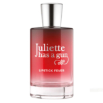 Un flacon de parfum en verre transparent avec un bouchon métallique et un liquide rouge dégradé. L'étiquette indique "Juliette has a gun" en texte blanc, avec "LIPSTICK FEVER" en dessous. Dakar