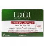 Une boîte verte et blanche de complément alimentaire Luxéol pour les cheveux, étiqueté "Chute de Cheveux Réactionnelle" pour un programme de 3 mois, contenant 90 gélules, ciblant le stress, la fatigue, et la chute de cheveux post-grossesse. Dakar