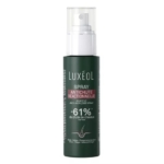Un flacon de Luxéol Spray Antichute Réactionnelle, un spray anti-chute réactif, avec un corps vert foncé, un embout de pulvérisation blanc et un texte soulignant une réduction revendiquée de 61 % de la chute des cheveux. Dakar