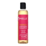 Une bouteille de Mielle Babassu Conditioning Shampoo avec une étiquette rose, conçue pour les cheveux secs et bouclés ; la bouteille contient 8 fl oz (240 ml) et est sans sulfate et sans colorant. Dakar