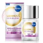 Le produit NIVEA Luminous 630° Skin Glow Exfoliante Líquido est présenté ; un flacon transparent avec un couvercle argenté se trouve devant sa boîte assortie. L'étiquette indique 100 ml et met en évidence les ingrédients AHA, PHA et aloe vera. Dakar