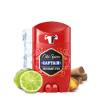Un stick de déodorant Old Spice Captain rouge est représenté avec des glaçons, une tranche de citron vert, des bâtons de cannelle et un morceau de gingembre disposés autour de lui sur un fond blanc. Dakar