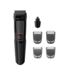 Tondeuse électrique noire avec poignée texturée, présentée avec un accessoire pour les poils du nez et quatre protections de tondeuse de tailles différentes, le tout disposé sur un fond blanc. Dakar