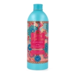 Un flacon rose et sarcelle de la crème de bain aromatique Tesori d'Oriente Ayurveda, orné de motifs floraux et portant l'inscription "Olio di Amla e Patchouli" sur le devant. Dakar