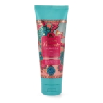 Tube turquoise de crème de douche aromatique Tesori d'Oriente Ayurveda, orné d'un motif floral décoratif et d'une étiquette rouge, or et turquoise, avec un texte mettant en avant l'amla et le patchouli en tant qu'ingrédients clés. Dakar