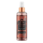 Un flacon pulvérisateur cuivré de la brume pour le corps Tesori d'Oriente Hammam à l'argan et à la fleur d'oranger, avec des motifs floraux et un bouchon transparent. Dakar