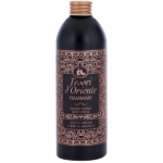 Un flacon noir de crème de bain Hammam Tesori d'Oriente avec des dessins en cuivre complexes et une étiquette portant la mention "Olio di Argan e Fiori di Arancio". Dakar