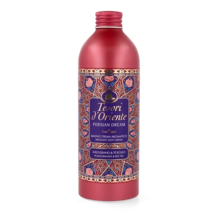 Un flacon rouge de crème de bain aromatique Tesori d'Oriente Persian Dream, décoré de motifs complexes bleus, or et roses, dont l'étiquette mentionne la grenade et le thé rouge. Dakar