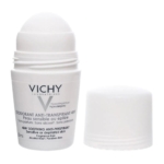 Un flacon de déodorant roll-on blanc étiqueté "Vichy Déodorant Anti-Transpirant 48H" pour les peaux sensibles ou épilées, avec son bouchon blanc placé à côté. L'emballage comporte des informations en français et en anglais. Dakar