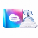 Un flacon de parfum en forme de nuage trône à côté d'une boîte colorée et irisée portant l'inscription « Ariana Grande Cloud ». Le flacon est doté d'une base blanche en forme de nuage et d'un bouchon bleu également en forme de nuage. Dakar