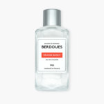 Flacon en verre transparent de l'eau de cologne Berdoues Orange Basilic avec un bouchon argenté et une étiquette blanche avec un texte noir et orange. Dakar