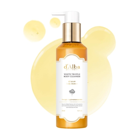 Un flacon pompe de « Nettoyant Corps Luxe à la Truffe Blanche et Huile Sérum » de D'Alba, d'une contenance de 275 ml, muni d'un bouchon doré et d'une étiquette blanche, est présenté devant des échantillons de sérum jaune sur fond blanc. Dakar