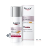 Un flacon et une boîte de 50 ml de Eucerin Anti-Pigment Day Cream SPF 30, qui contient du Thiamidol pour réduire les taches brunes. L'emballage est blanc avec des accents rose clair et gris, et le texte souligne la protection SPF 30. Dakar