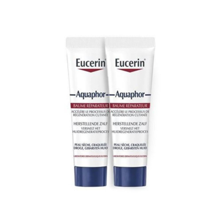 Deux tubes blancs de pommade cicatrisante Eucerin Aquaphor avec un texte bleu et rouge se tiennent debout côte à côte sur un fond blanc. Dakar