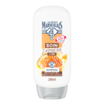 Un flacon blanc de 200 ml du soin capillaire « Soin Express 1 Min » de Le Petit Marseillais, au miel et au beurre de karité, orné d'un motif de nid d'abeille doré et du logo de la marque sur le devant. Dakar