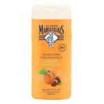 Un flacon de Le Petit Marseillais Douche & Bain Crème Extra Doux au parfum Abricot & Noisette, sur un emballage orange avec des images d'abricots et de noisettes. Le flacon contient 650 ml. Dakar