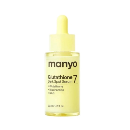 Un flacon jaune de Ma:nyo Sérum Éclaircissant à la niacinamide et au glutathion, de 30 ml, muni d'un bouchon compte-gouttes. L'étiquette mentionne le glutathion, la niacinamide et le NAG pour un éclaircissement ciblé de la peau. Dakar