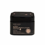 Une boîte noire de Mary and May Masque Peel-Off Ampoule Premium à Base d'Idébénone et de mûre 20 pièces, avec un texte et des graphiques dorés et blancs sur l'étiquette. Dakar