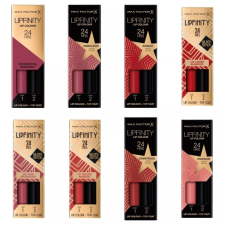 Huit rouges à lèvres Max Factor Lipfinity Lip Colour, des rouges à lèvres longue tenue avec baume 24 heures à double embout, dans des teintes bordeaux, rose, rouge et nude, sont disposés sur deux rangées sur un fond blanc. Dakar