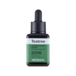 Un flacon de Skin1004 Madagascar Centella Probio Cica Intensive Ampoule Sérum Repulpant et Hydratant 50ml (Copie), avec une étiquette verte et blanche et un bouchon compte-gouttes noir, affiche "22700" et met en évidence les principaux ingrédients hydratants. Dakar