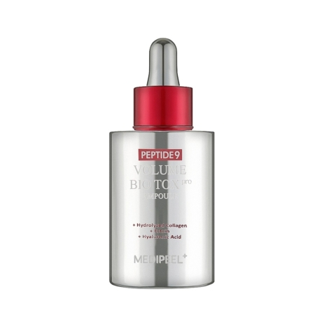 Le flacon argenté de 100 ml de Medipeel Sérum en Ampoule Éclat Anti Age Peptide 9 Volume Biotox Ampoule Pro est doté d'un bouchon rouge en forme de goutte et d'un texte soulignant les ingrédients suivants : collagène hydrolysé, botox et acide hyaluronique. Dakar
