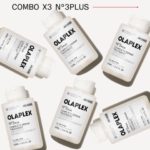 Six flacons d'Olaplex N°3 Plus Traitement Réparateur Complet sont disposés sur un fond blanc, avec le texte "COMBO X3 N°3PLUS" au-dessus d'eux. Les flacons sont présentés sous différents angles. Dakar