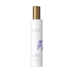 Un flacon blanc de brume corporelle Rituals Tulip & Japanese Yuzu avec un bouchon doré et un dessin floral bleu sur le devant, étiqueté comme faisant partie de la Collection Amsterdam, 50 ml. Dakar