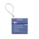 Une boîte bleue d'Uriage Bébé 1ère Crème Lavante Solide 100g avec un cordon de suspension, conçue pour les bébés, avec de l'edelweiss bio et 90% d'ingrédients d'origine naturelle. Dakar
