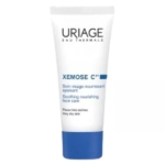 Un tube blanc et bleu de Uriage Xemose Cérat Soothing Nourishing Face Care, étiqueté pour les peaux très sèches. Le texte du produit est rédigé en français et en anglais. Dakar