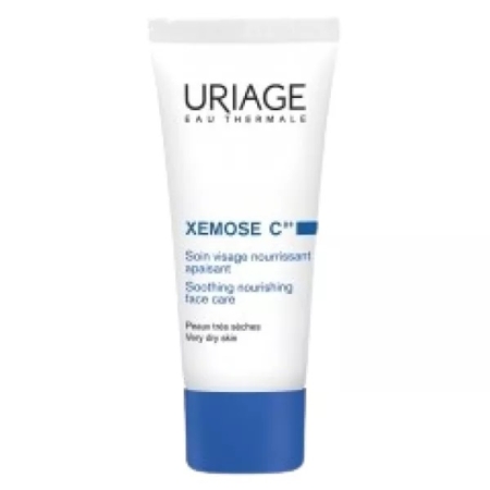 Un tube blanc et bleu de Uriage Xemose Cérat Soothing Nourishing Face Care, étiqueté pour les peaux très sèches. Le texte du produit est rédigé en français et en anglais. Dakar