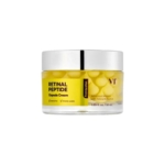 Un pot transparent muni d'un couvercle argenté contient des gélules jaunes portant l'étiquette « Vt Crème en Capsules aux Peptides Rétiniens Anti-Rides et Ridules 50 ml » ; les couleurs vives, jaune et blanc, de la marque soulignent ses bienfaits anti-âge. Dakar