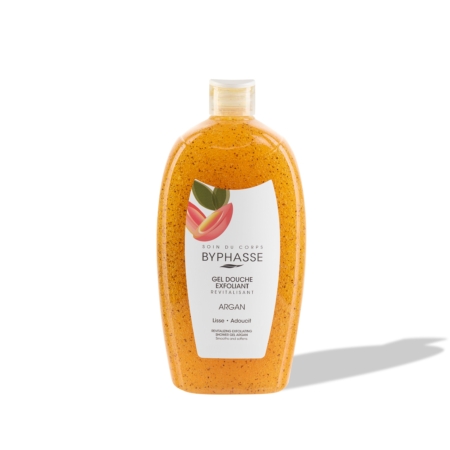 Un flacon en plastique transparent contenant le gel douche exfoliant « Routine Glow Sunshine Éclat du Teint » de Byphasse, à l'huile d'argan. Le gel de couleur orange contient de petites billes, et l'étiquette blanche comporte un texte ainsi qu'une illustration représentant un fruit d'argan. Le flacon projette une ombre sur le fond blanc. Dakar